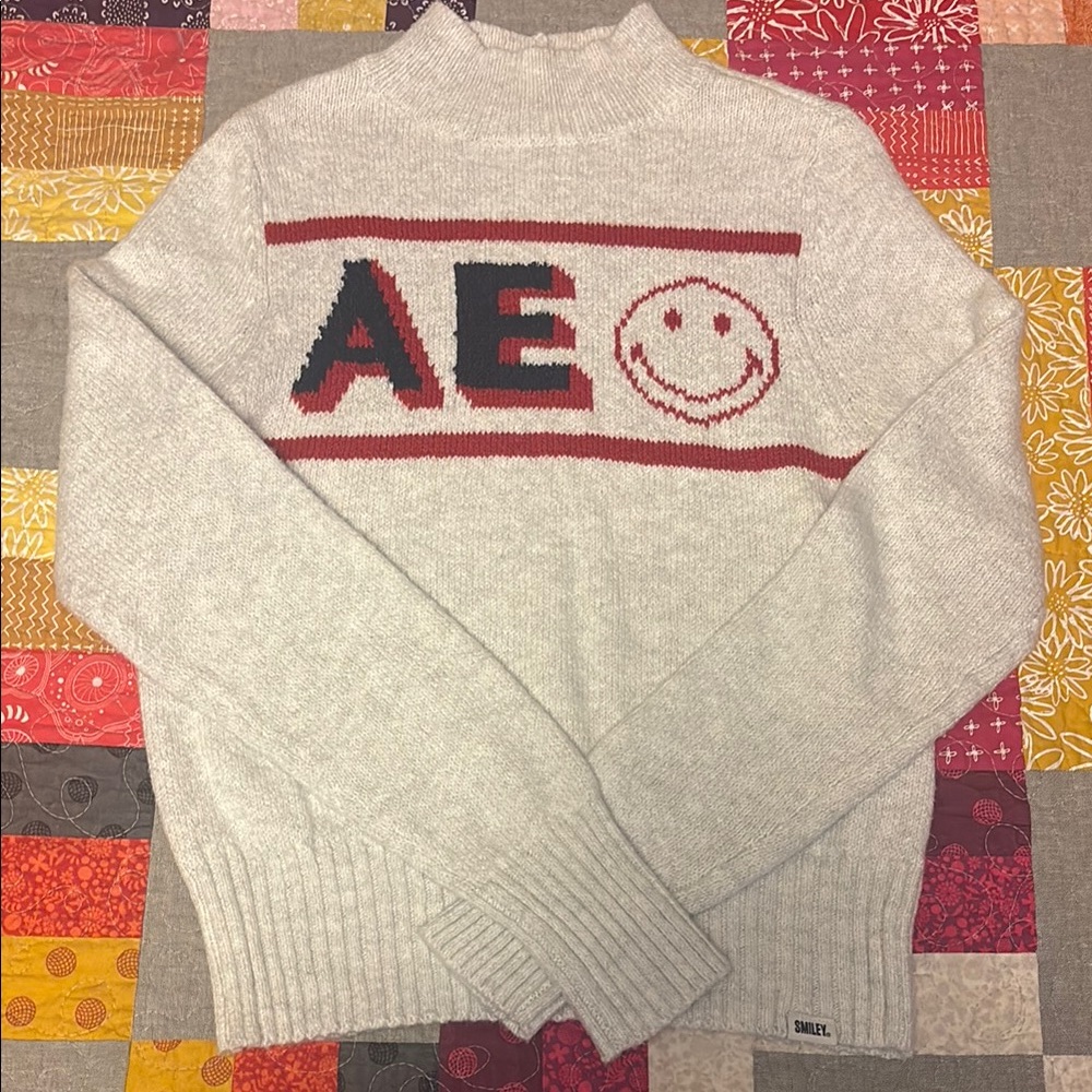 American Eagle Outfitters mock turtleneck Cream Sweater with Red & blue Design